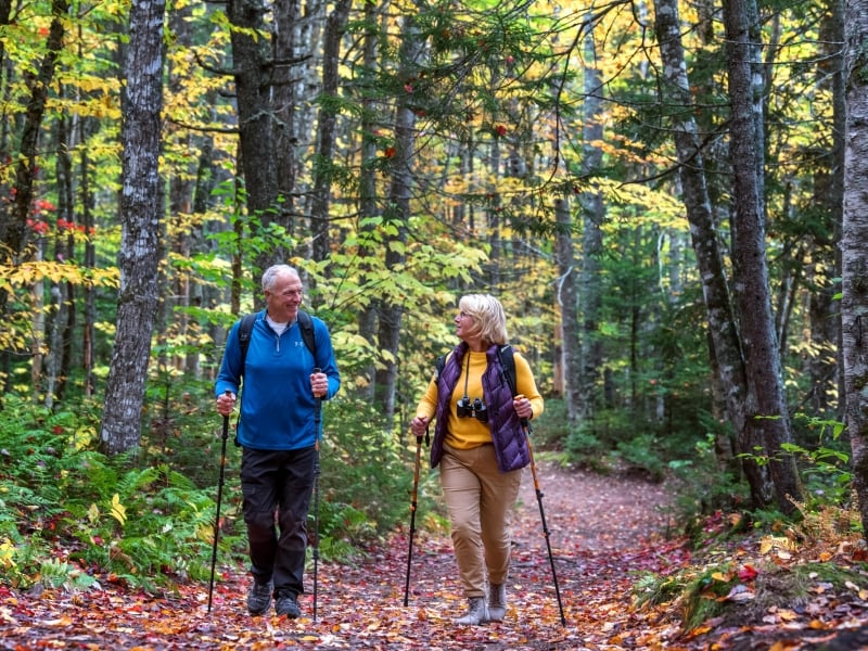Couple hiking in Bonshaw Provincial Park in fall